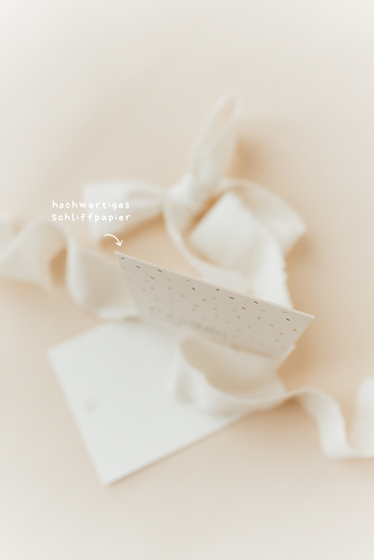 Nahaufnahme Postkarte „freudentag“ – Papierstruktur und Design sichtbar - beherzigt